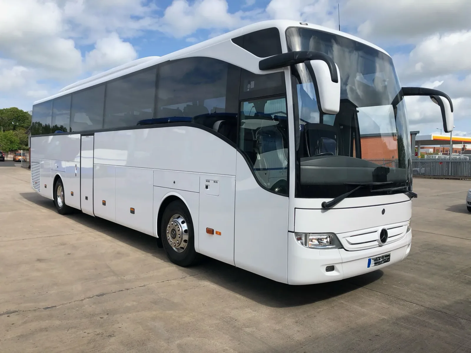 White BusCom Mercedes Tourismo coach for group transfers in Helsinki